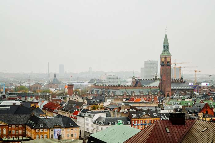 Copenhagen, Denmark cityscape with tower and cranes 4K