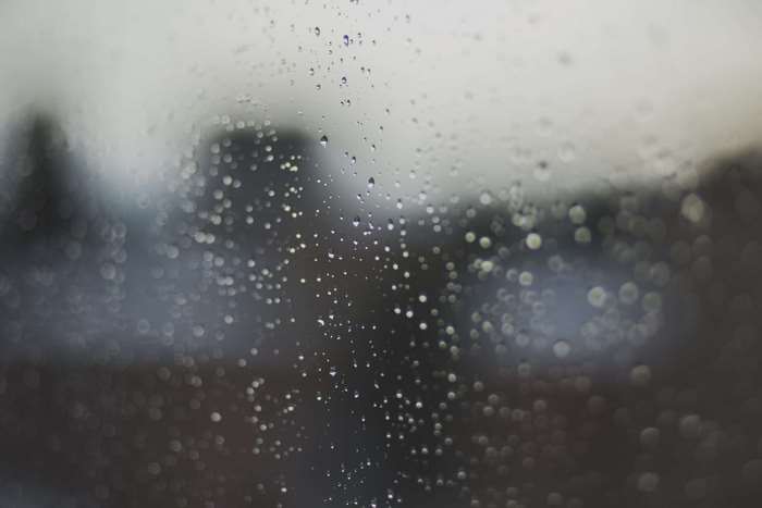 Raindrops on a window at night