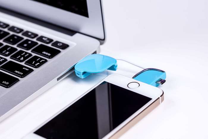 Laptop connected to iPhone with USB drive