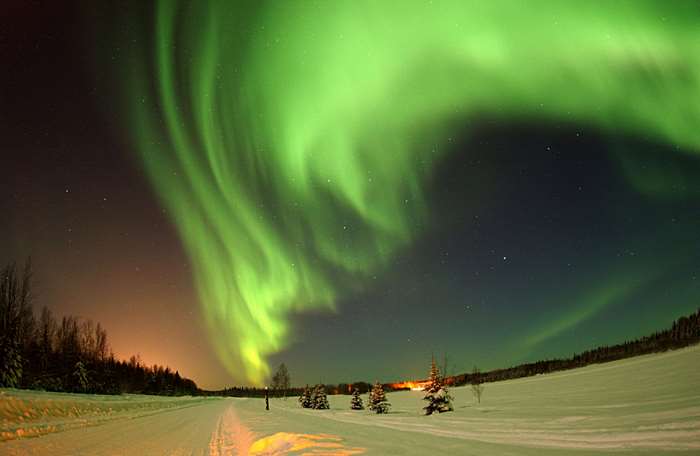 Aurora Borealis over a Snowy Landscape
