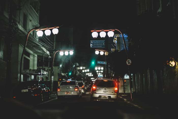 Cars in traffic jam at night with street lights