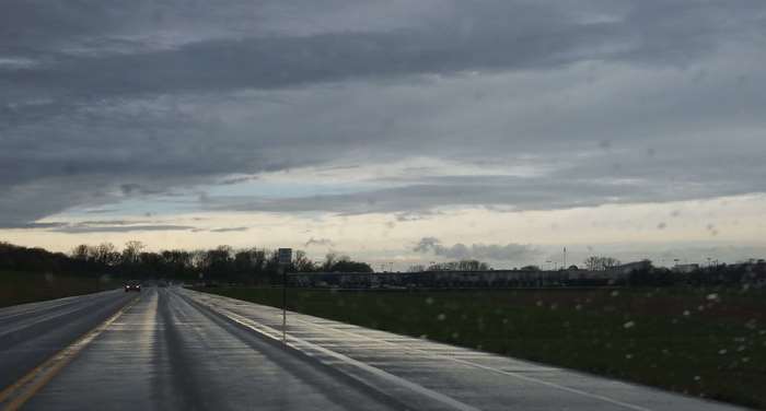 Rainy Road with Dark Clouds