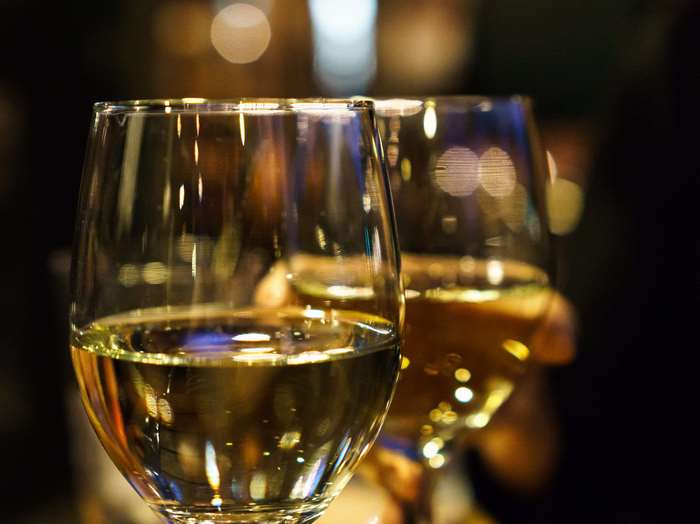 Two wine glasses with white wine