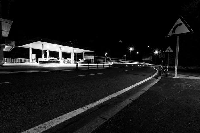 Long exposure of a gas station and road at night