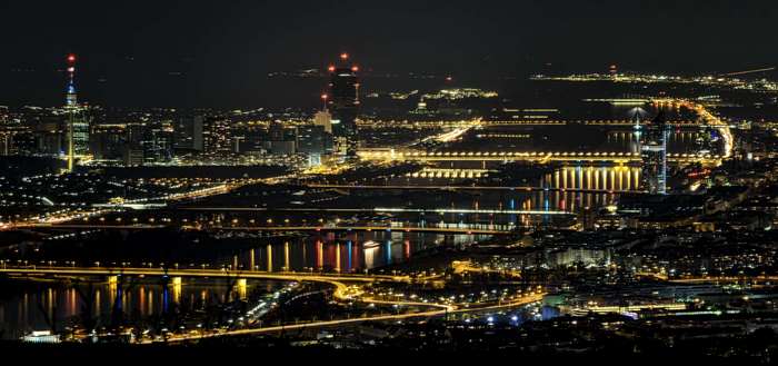 Vienna cityscape at night with Danube river and bridges