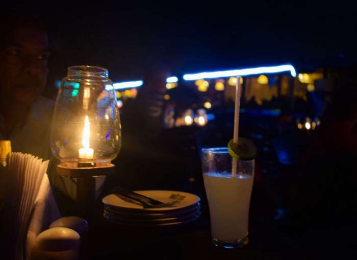 Candle lantern and cocktail at night