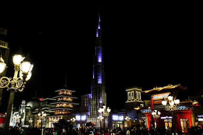 Burj Khalifa at night with surrounding buildings