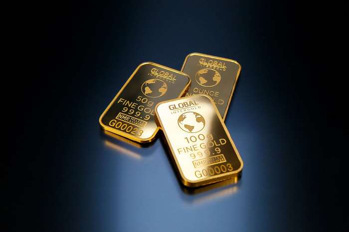 Three gold bars with Global Intergold branding