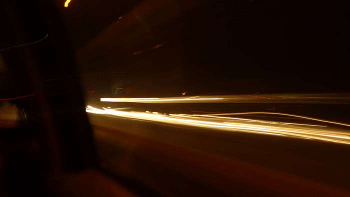 Car lights on a road at night
