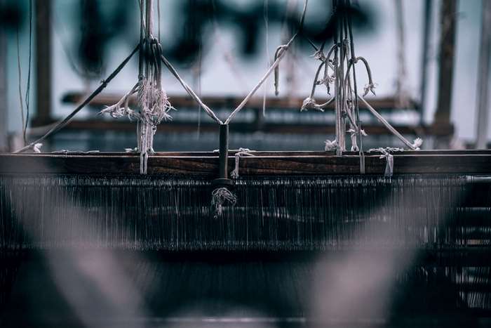 Close up of a loom with threads