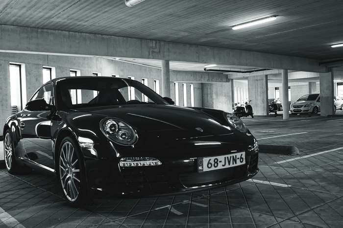 Black Porsche 911 in Underground Garage