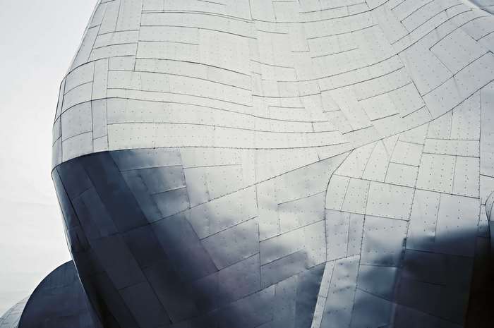 Abstract metallic building facade with geometric patterns
