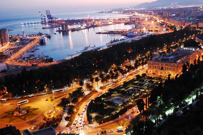 Malaga city and harbor at dusk, Spain