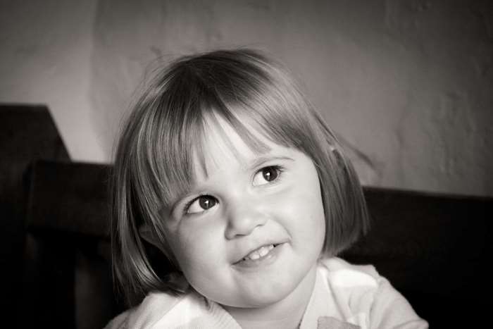 Monochrome portrait of a young girl smiling