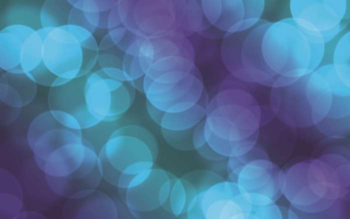 Abstract bokeh lights pattern with blue and purple hues
