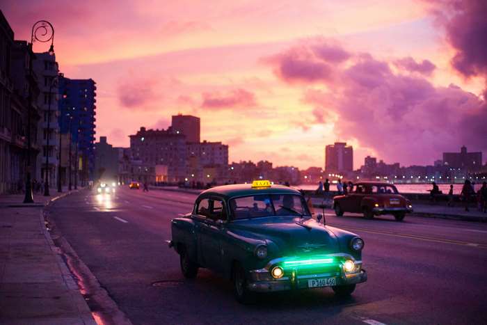Vintage taxi car in Havana, Cuba at sunset 4K