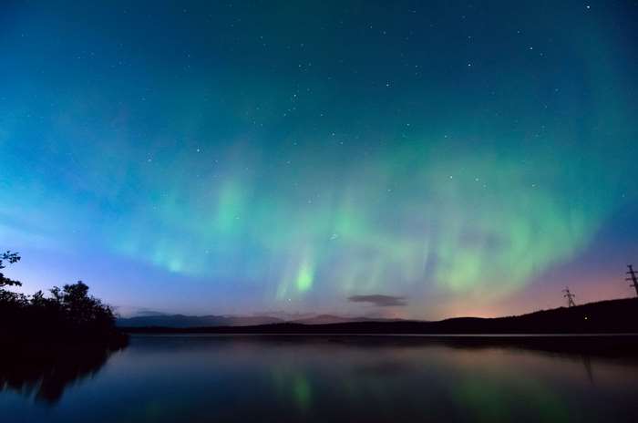 Aurora Borealis over a lake at night