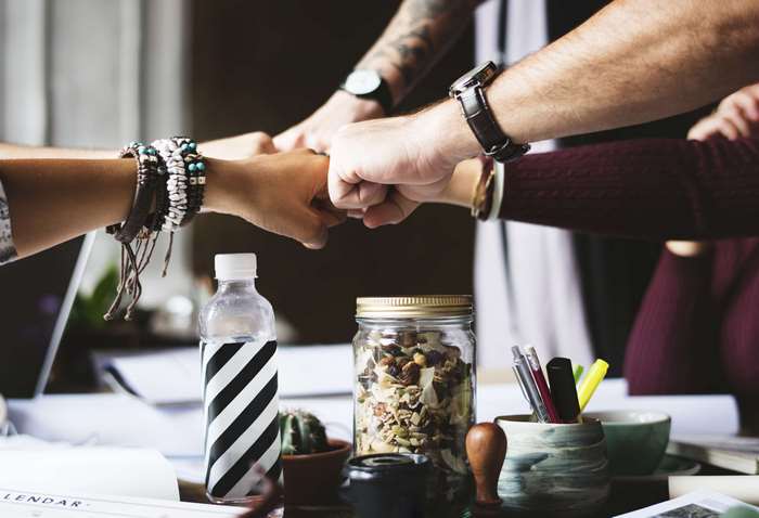 Teamwork and collaboration with fist bump