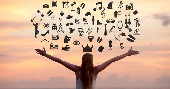 Woman with arms outstretched and icons floating above