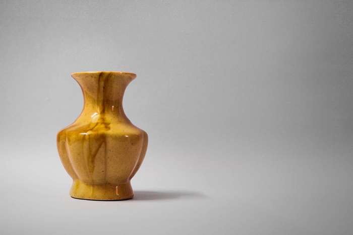 Yellow ceramic vase with brown drips