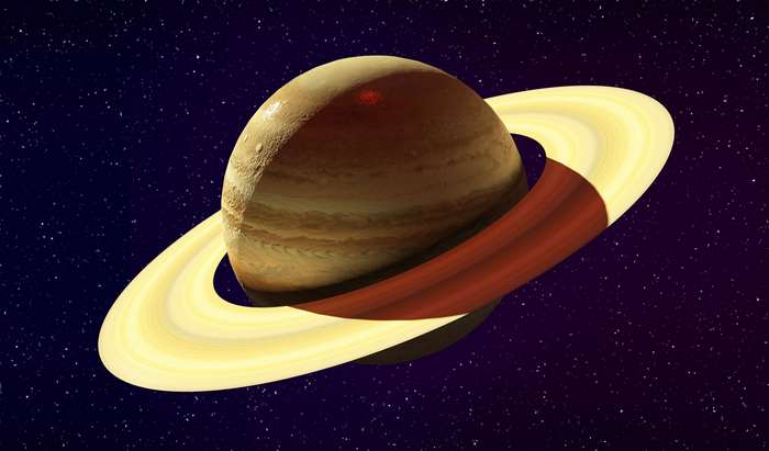 Saturn with rings in outer space with stars