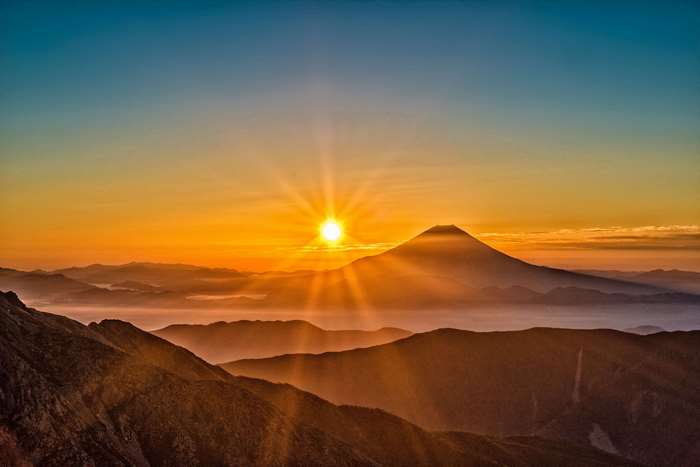 Sunrise over mountains with Mount Fuji