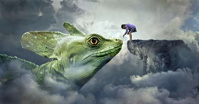 Girl feeding a large green lizard in the clouds