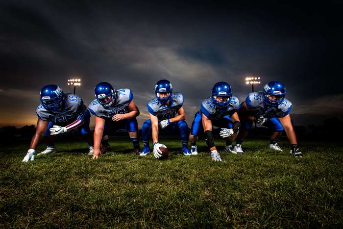 Football players in uniform on field 4K