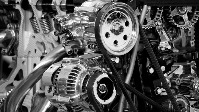 Polished chrome car engine with belts and gears