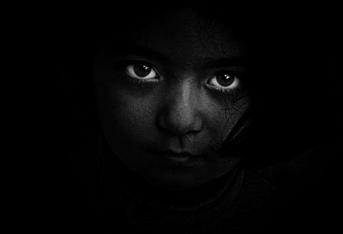 Black and white portrait of a young girl's face