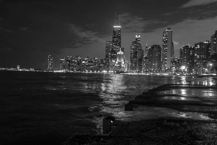 Chicago skyline at night over Lake Michigan 4K