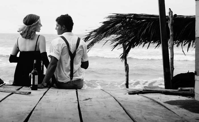 Couple on a wooden pier by the ocean