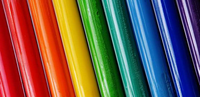 Colorful paint tubes in a rainbow pattern