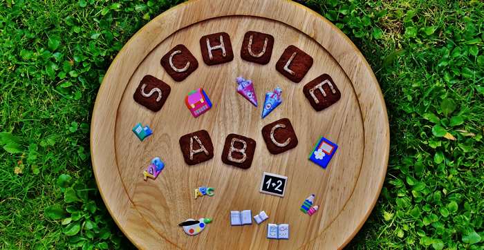 School supplies and letters on a wooden board