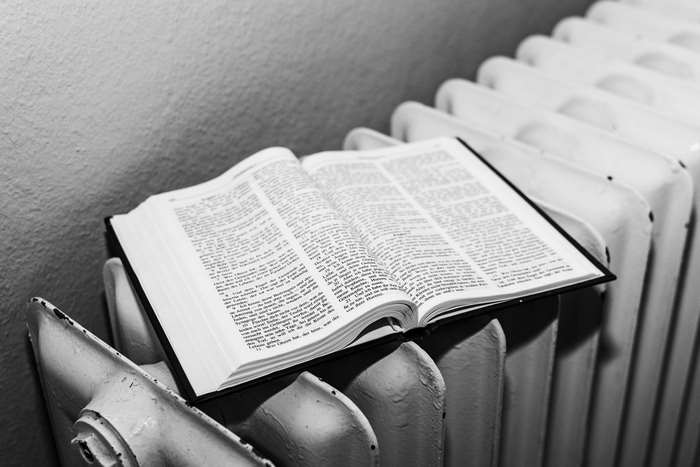 Open Bible on a Radiator