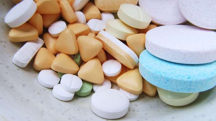 Pile of colorful pills and tablets 4K