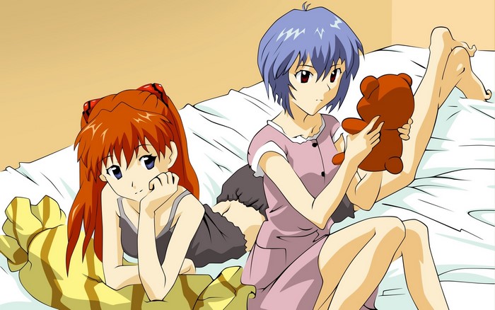 Asuka and Rei with a teddy bear on a bed