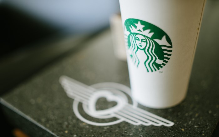 Starbucks coffee cup with logo and heart straw topper