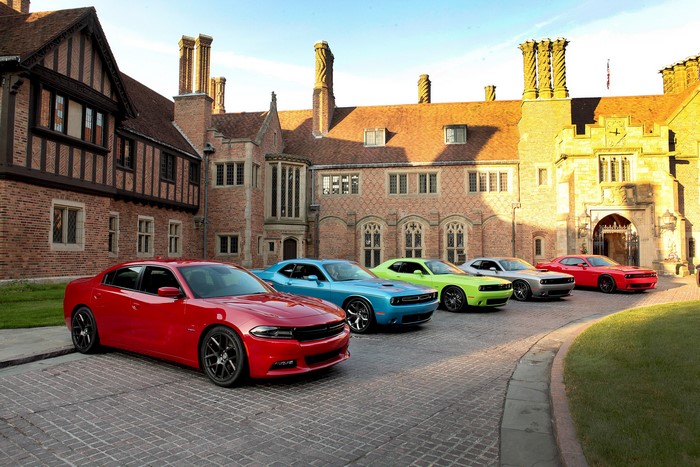 Dodge Charger and Challenger Cars in Front of a Mansion