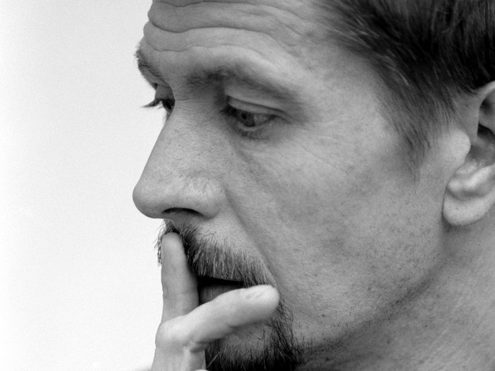 Gary Oldman in profile, thinking