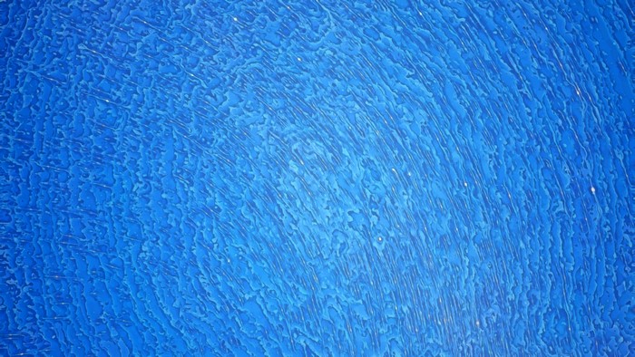 Abstract blue texture with swirling patterns