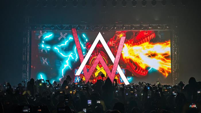 Alan Walker logo on stage with crowd