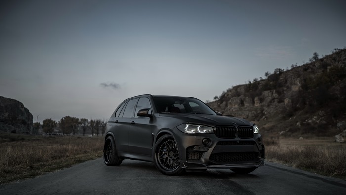 Matte black BMW X5 on a road