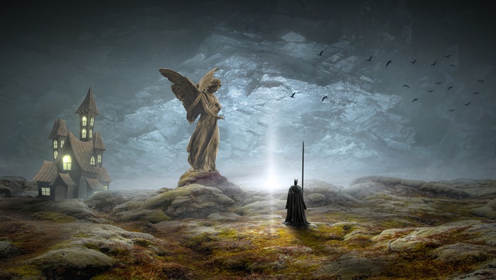 Fantasy landscape with angel statue and cloaked figure