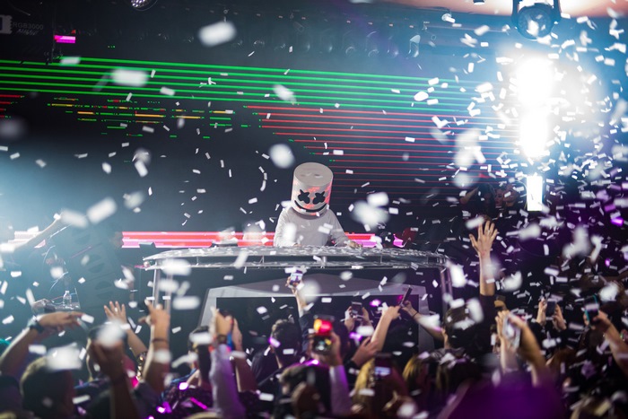 Marshmello performing on stage with confetti