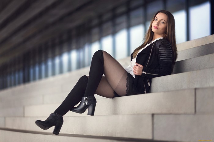 Brunette Woman Relaxing on Concrete Steps