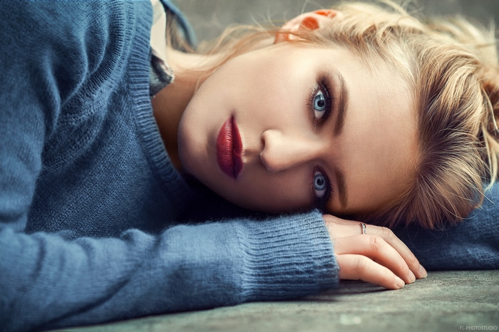 Pensive Woman with Striking Blue Eyes