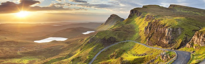Mountain road with lakes at sunset