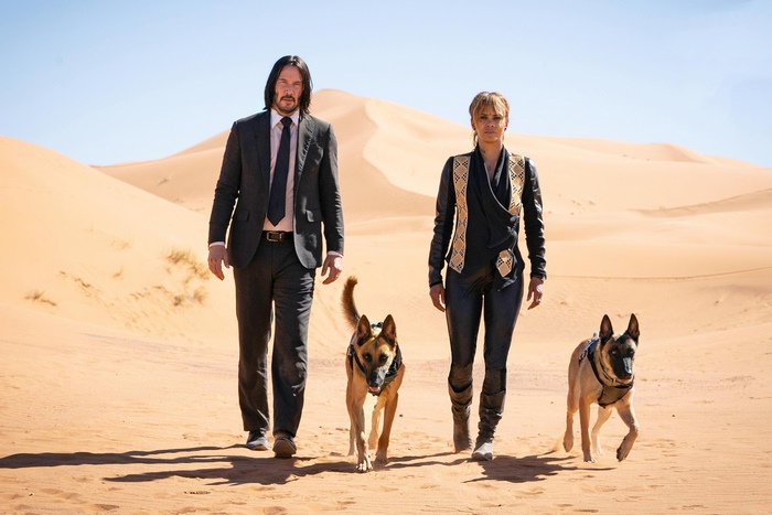 John Wick and Sofia with dogs in desert