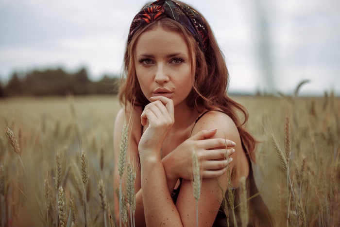 Woman with headband in a wheat field